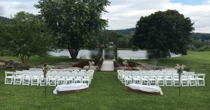 Wedding chairs rental set up near pond outdoors
