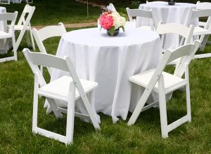 rent tables and chairs for rental white tablecloth flowers