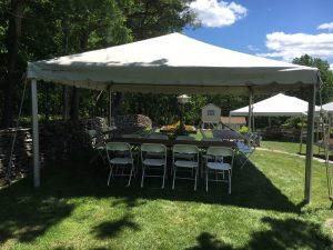 large outdoor tent rental with table and chairs